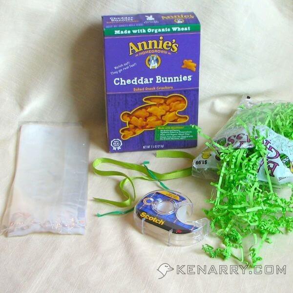 To make Cheddar Bunny Carrots you need: clear bags, clear tape, twist ties, ribbon, Easter grass and cheddar bunny crackers. - Kenarry.com