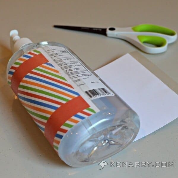 Attaching the printable label to the hand sanitizer bottle 