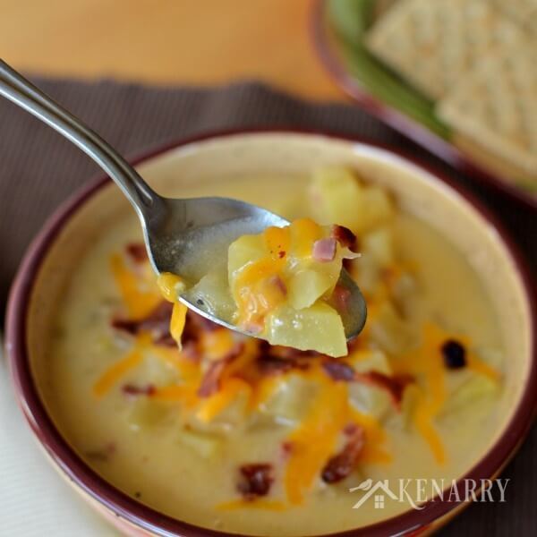 This easy Slow Cooker Potato Soup is loaded with bacon, ham and cheese. You can enjoy it with a side salad and bread as a great comfort food during those long, cold fall or winter days. #crockpot #slowcooker #kenarry