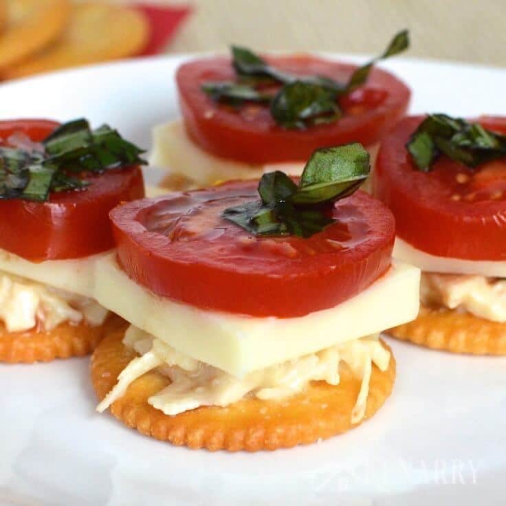 chicken caprese crackers served on a plate as an appetizer