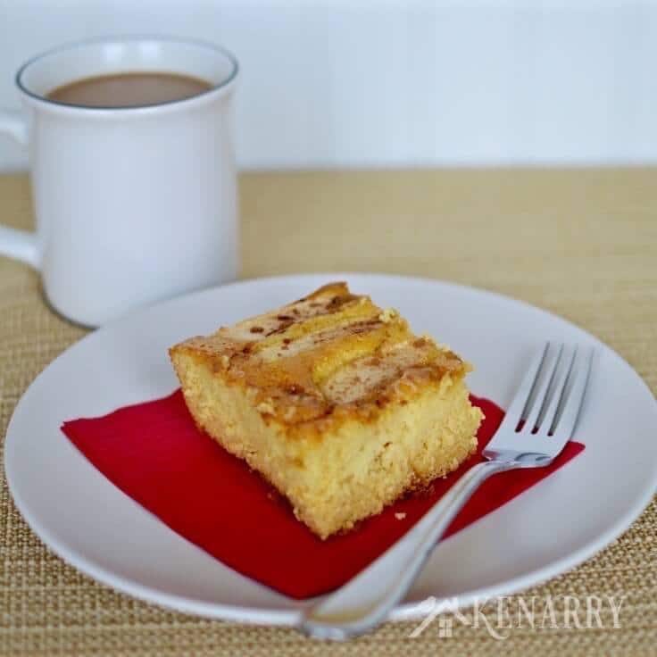 caramel apple coffee cake served with a cup of coffee