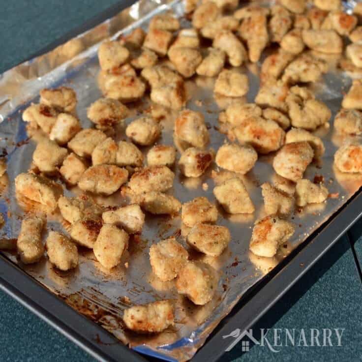 Popcorn chicken nuggets on a sheet pan