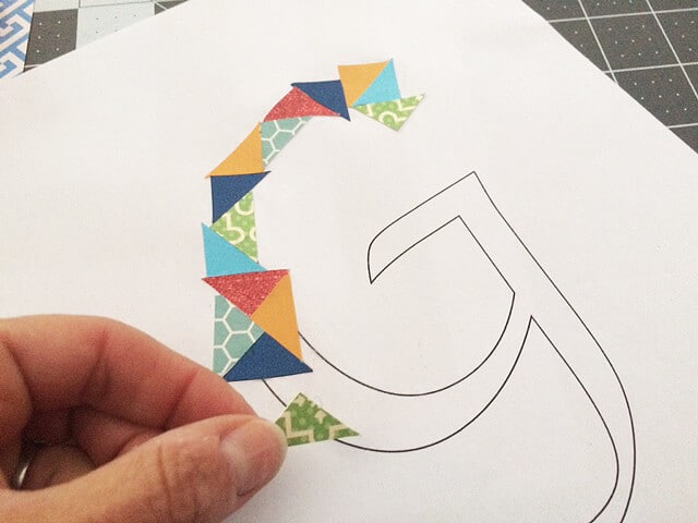 DIY initial art created with cut paper