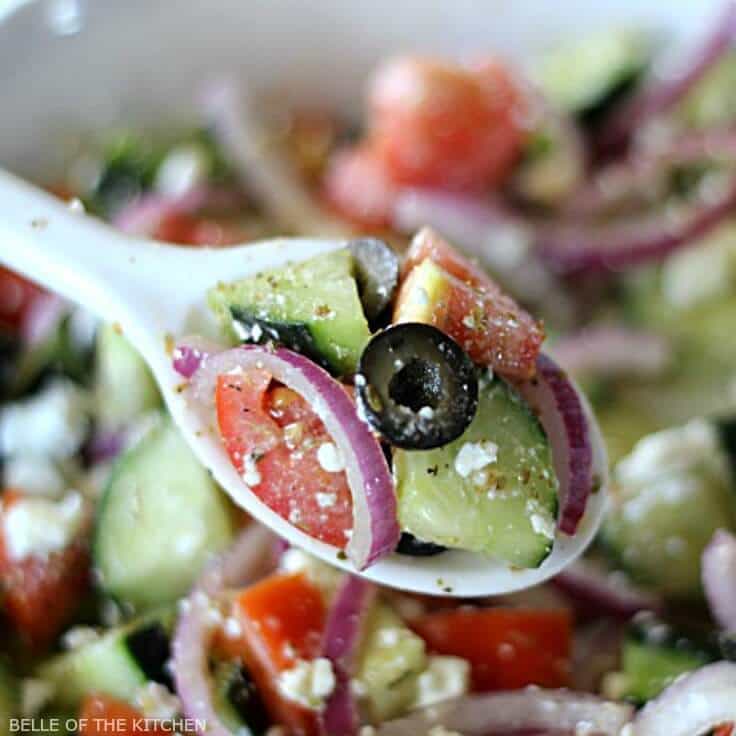 This chopped Cucumber Greek Salad and dressing recipe is light and refreshing, and full of healthy ingredients. With minimal prep, it makes an easy side dish for any meal! #greeksalad #summerfood #kenarry