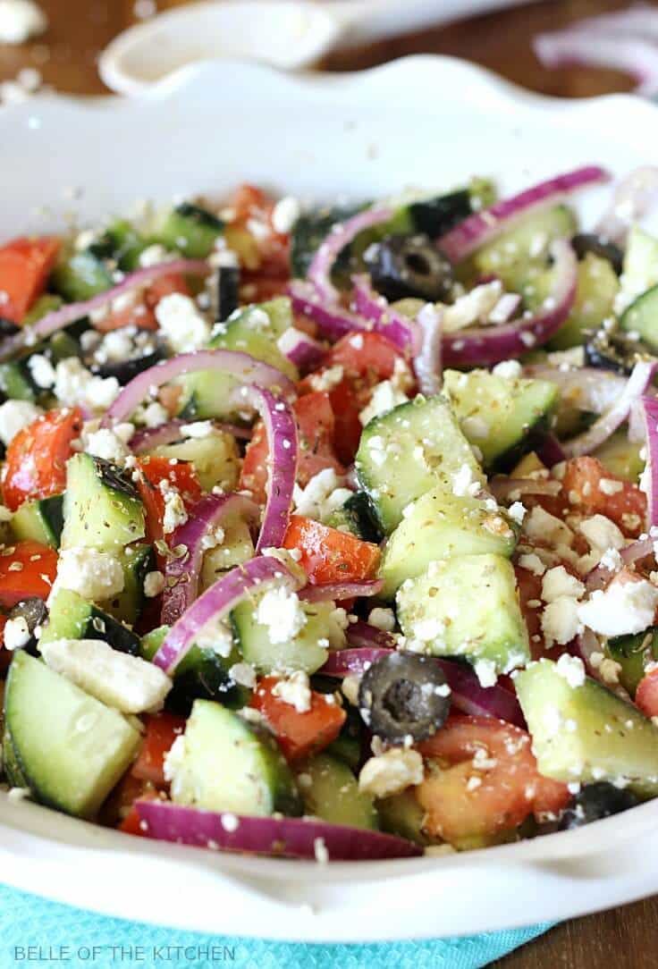 This chopped Cucumber Greek Salad and dressing recipe is light and refreshing, and full of healthy ingredients. With minimal prep, it makes an easy side dish for any meal! #vegetarian #healthy #kenarry