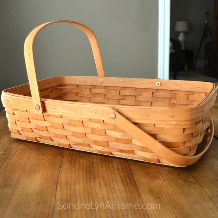 A longaberger basket that can be transformed into a bassinet baby shower centerpiece 