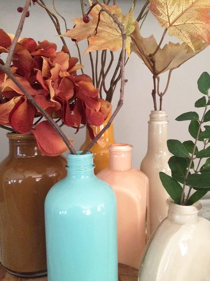 DIY painted glass vases in beautiful fall colors with a pop of blue.