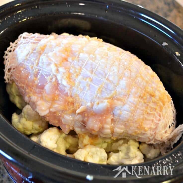 What an easy way to make turkey! This recipe for Slow Cooker Turkey includes Garlic Mashed Cauliflower right in the same crockpot for a simple and delicious dinner idea.