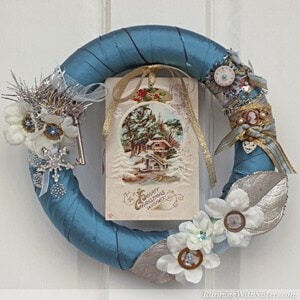 Make a vintage Victorian style wreath for the holidays with steampunk watch faces and an old Christmas postcard.