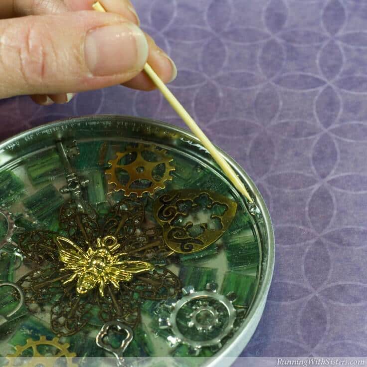 Make Steampunk Mosaic Coasters using clear resin. Learn how to mix and pour resin to show off your steampunk mosaic!