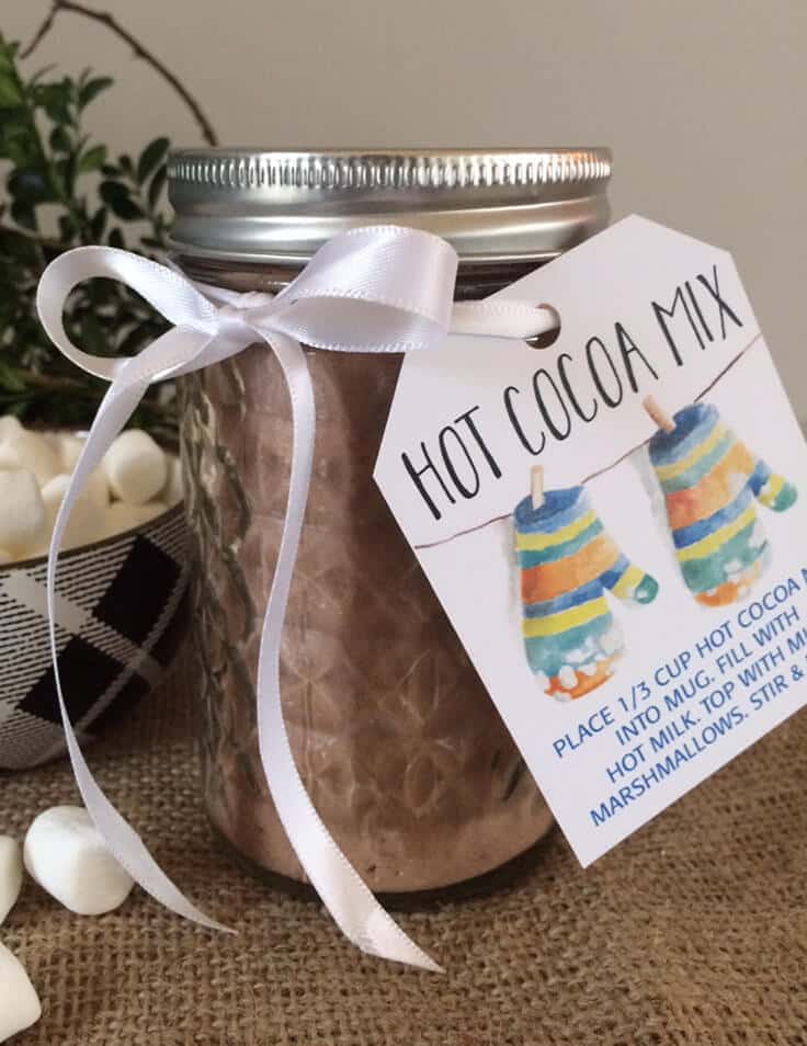 This homemade hot cocoa mix recipe in a jar makes a great DIY Christmas gift idea plus there are free printable labels with mittens for winter. You can also make a big batch to serve at a party. #hotcocoa #hotcocoabar #kenarry