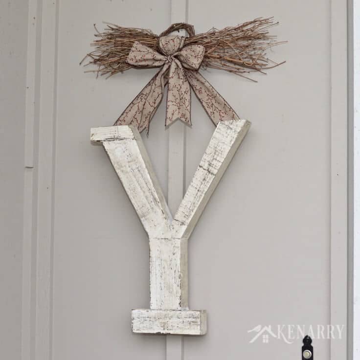 Love this large winter monogram decor for outside the front door. It would also be a beautiful rustic idea for indoor use at home.