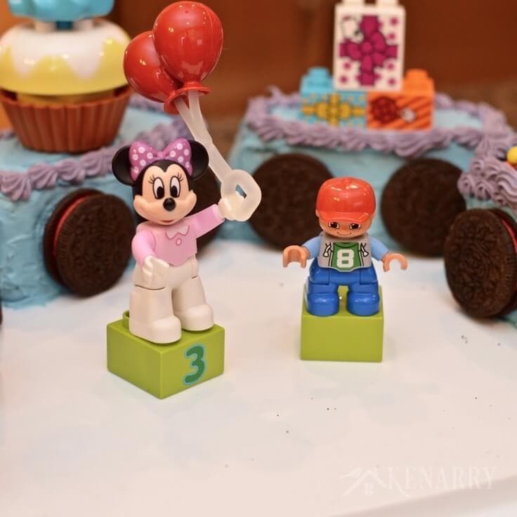 Love this Mickey Mouse Cake shaped like a train! It's a really easy idea for a child's birthday party using legos.