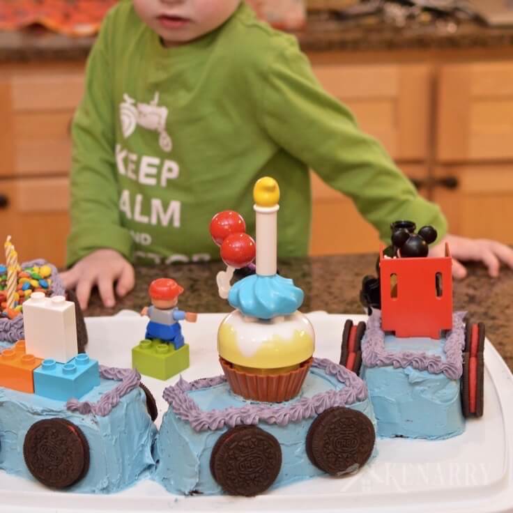 Love this Mickey Mouse Cake shaped like a train! It's a really easy idea for a child's birthday party using legos.