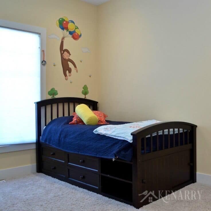 Boys bedroom plans involve removing the Curious George decal and painting the walls to look like outer space.