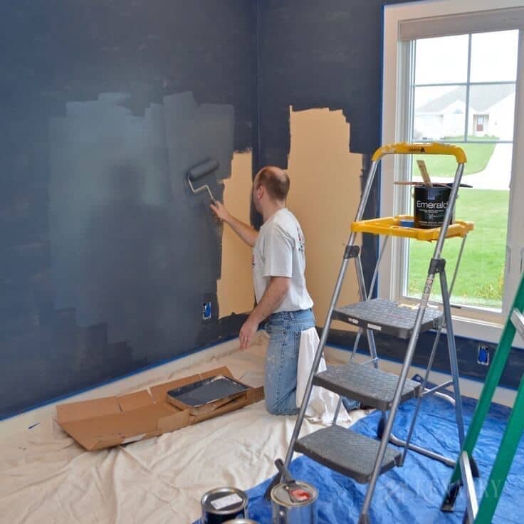 Creating an outer space boys bedroom starts with a huge galactic change in paint color. The walls were transformed from pale yellow with outerspace paint from Sherwin-Williams.