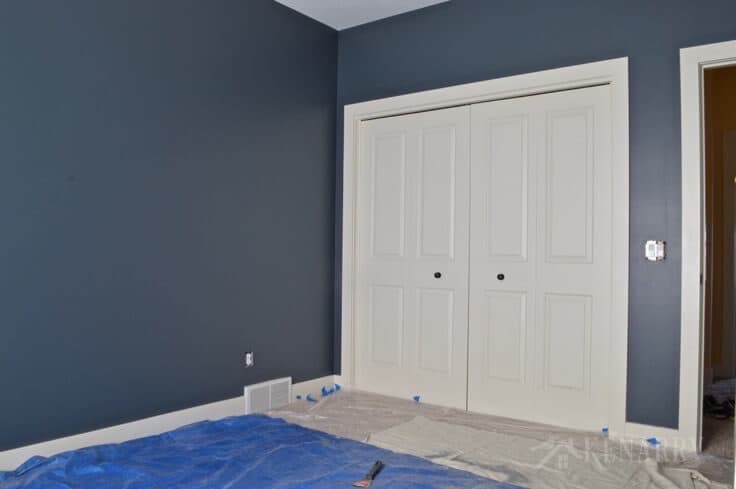 Creating an outer space boys bedroom starts with a huge galactic change in paint color. The walls were transformed from pale yellow with outerspace paint from Sherwin-Williams.