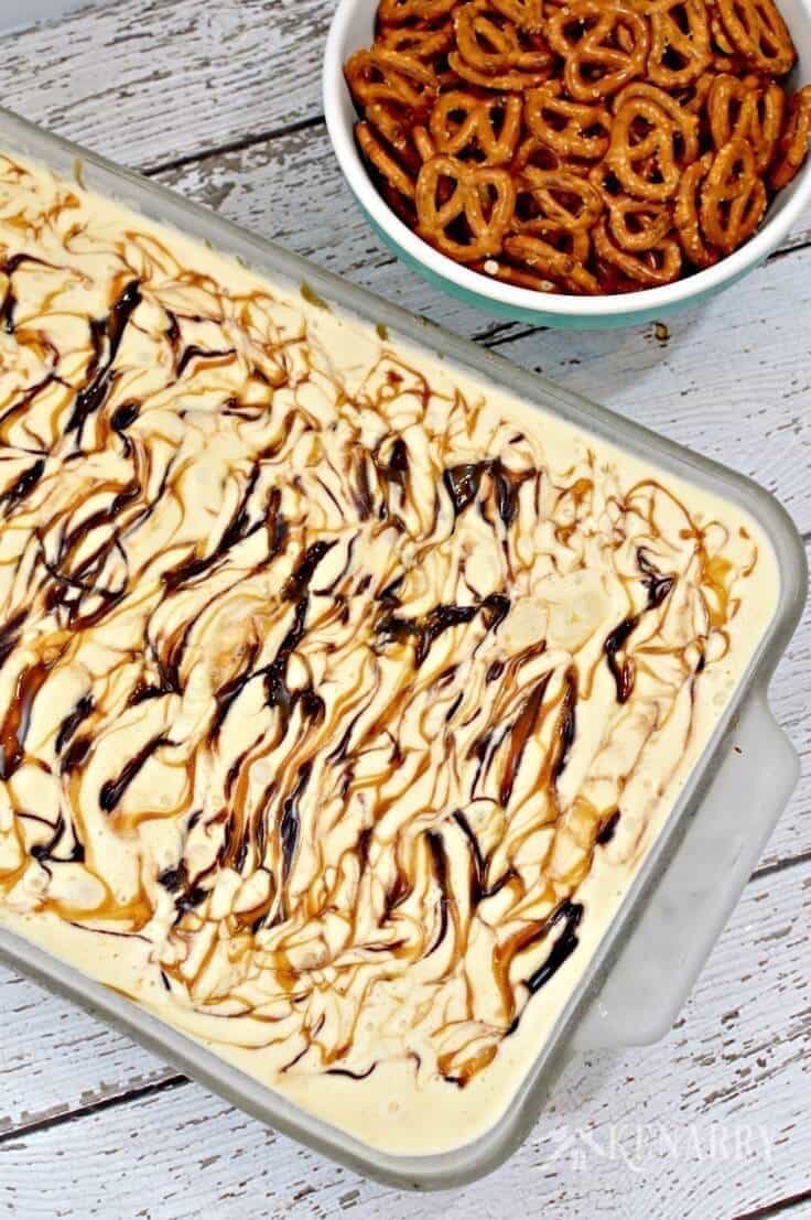 Unsliced Caramel Fudge Ice Cream Cake with a pretzel crust