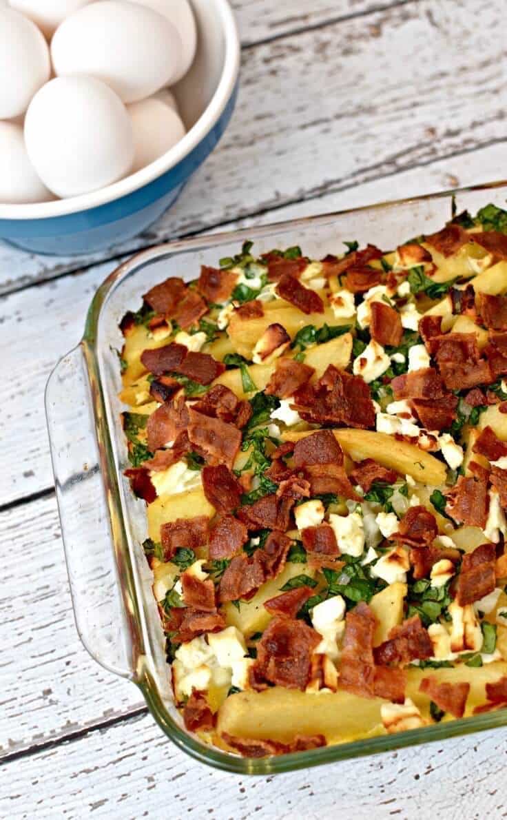 Bacon, spinach and feta breakfast casserole in a baking dish right out of the oven