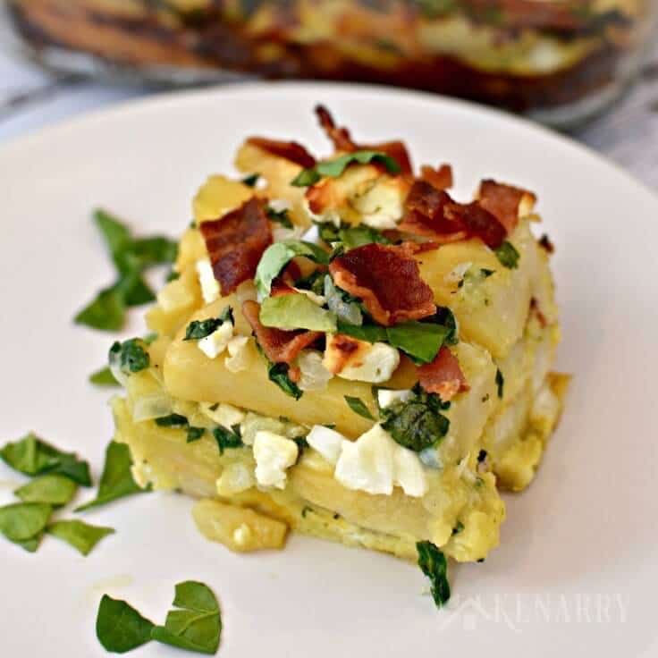 Bacon, spinach and feta breakfast casserole served on a white plate