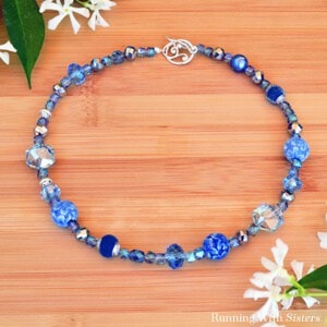 Learn to bead a necklace with this video tutorial. We'll show you how to string beads and how to put on the clasp.