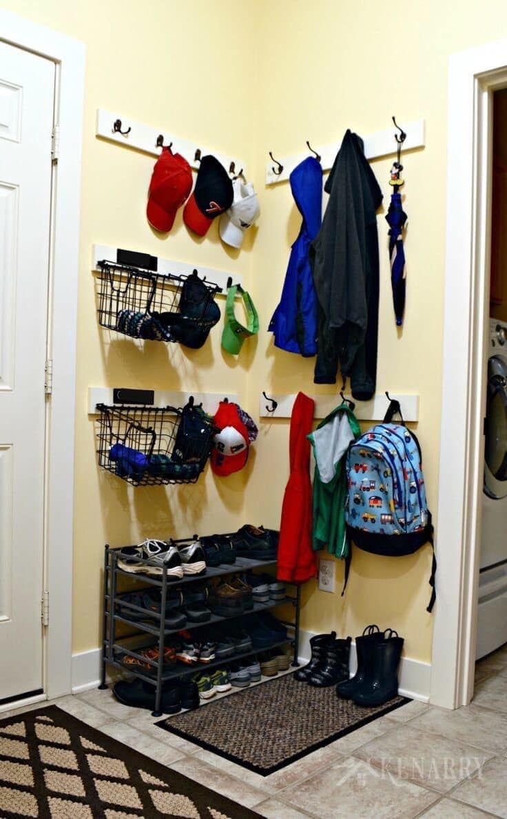 Adding coat hooks, hat racks and baskets to a mudroom or back hallway is a great idea to create organization out of chaos.
