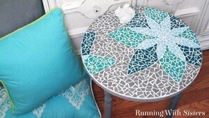 Learn how to mosaic a table including how to transfer a design, cut tiles, and mix and apply grout. This step by step tutorial will show you how!