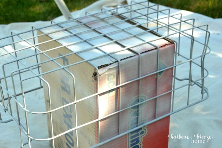 INDUSTRIAL FABRIC LINED BASKET: Turn a rusty old basket into a pretty industrial decor piece using spray paint and fabric. This easy tutorial will show you how!