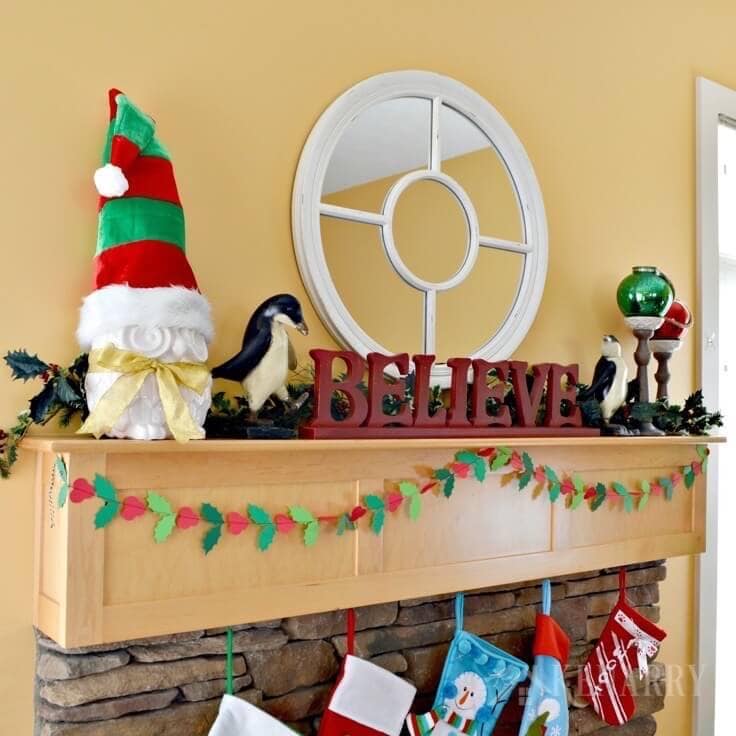 Love these Christmas mantel decor ideas to update a fireplace for the holidays with bright red and festive green accents! These easy ideas will have your living room ready for hosting holiday parties and all the fun events of the season.