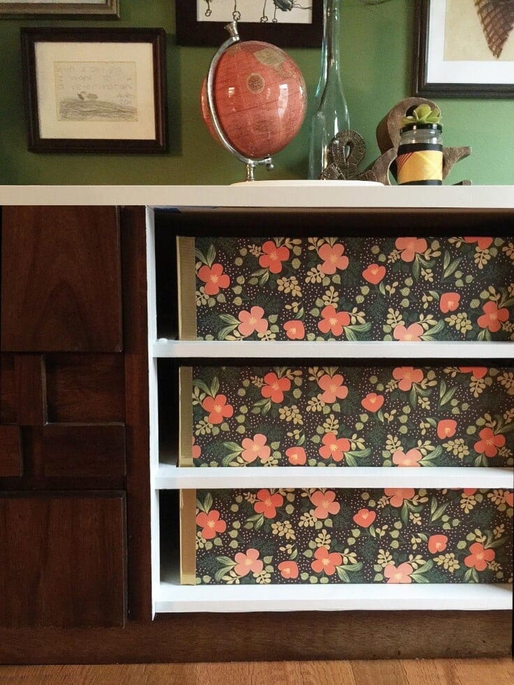 Pretty floral storage boxes made out of foam core inside open shelves