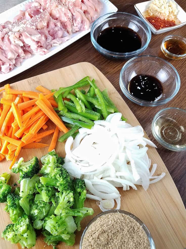 All the chopped veggies, meat, and sauces you need for sesame chicken stir-fry