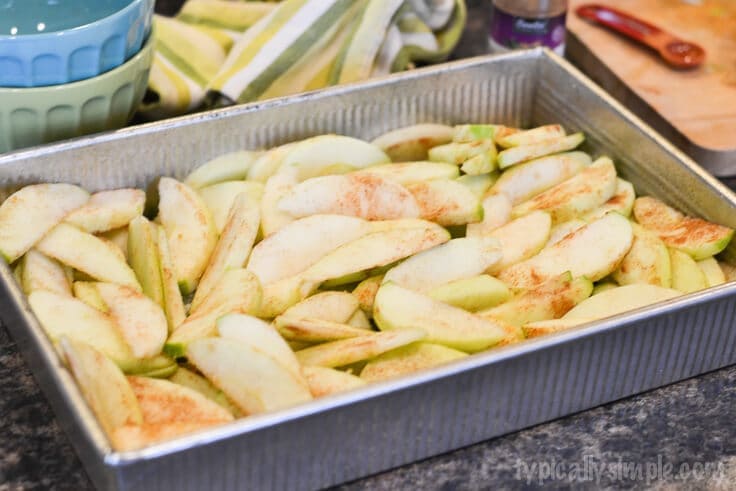 Sliced apples in a 9x13 inch baking pan