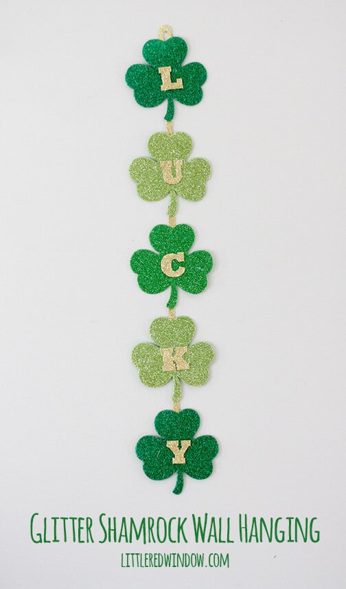 Glittery Lucky Shamrock Wall Hanging – Little Red Window - St. Patrick's Day Home Decor Ideas featured on Kenarry.com 