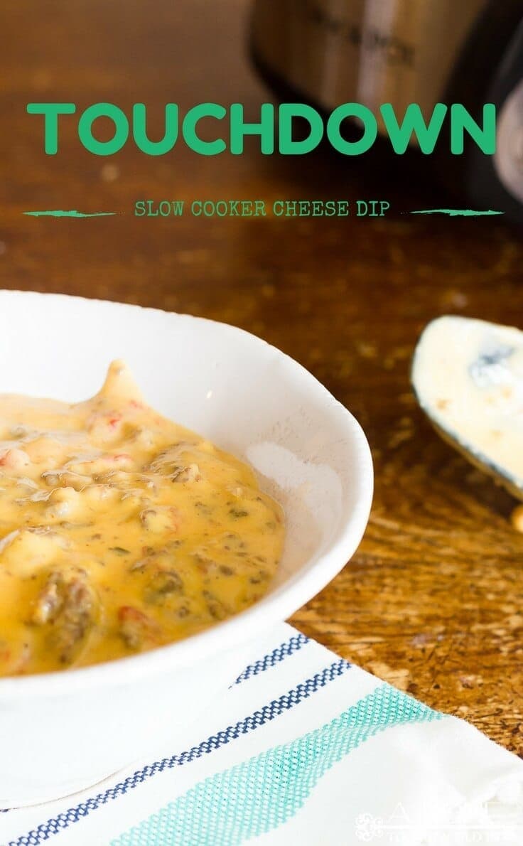 This easy Touchdown Slow Cooker Cheese Dip recipe will make you the MVP of your Super Bowl parties or get-togethers! This is one hearty meat and queso dip that you must try if you're looking for the perfect party appetizer! #slowcooker #partyfood #kenarry 