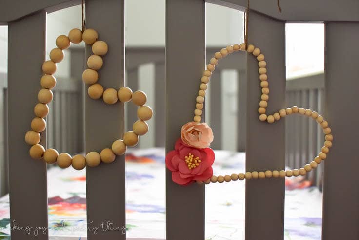 Learn how to make rustic DIY wood bead hearts to add the perfect farmhouse style touch to your nursery