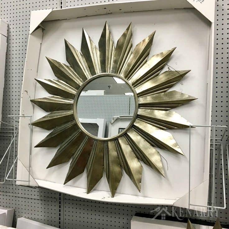 Large starburst mirror as possible decor for new sunroom addition on a renovated cottage.