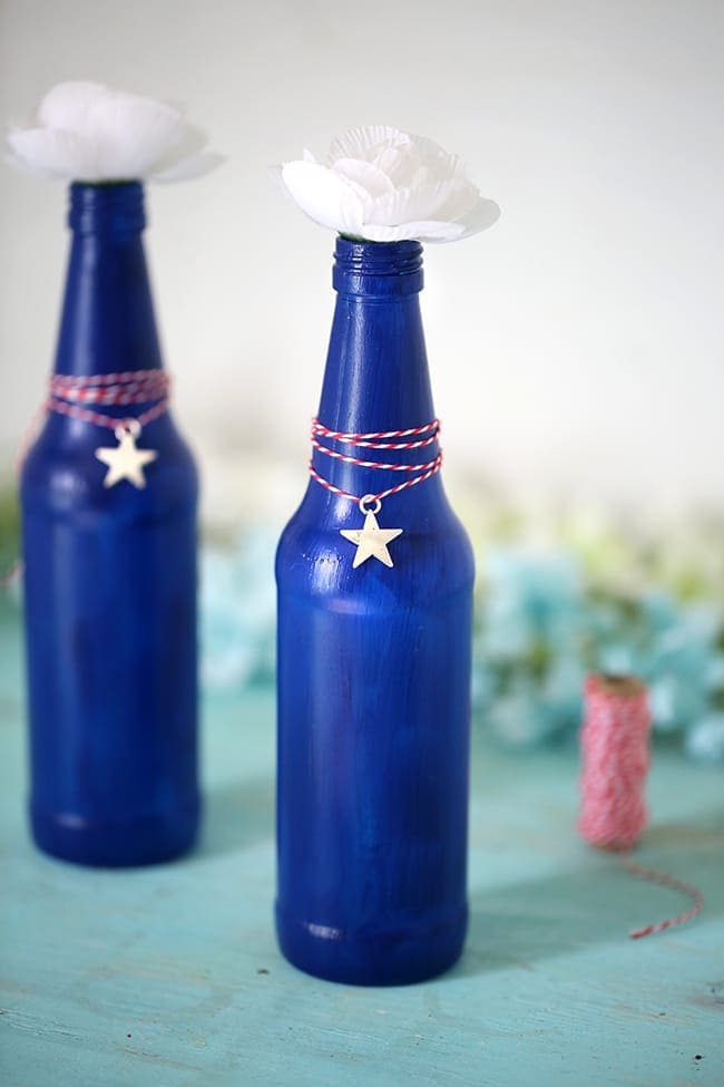 DIY Blue Glass Bottles – Reasons to Skip the Housework - Patriotic Decor Ideas for the 4th of July featured on Kenarry.com