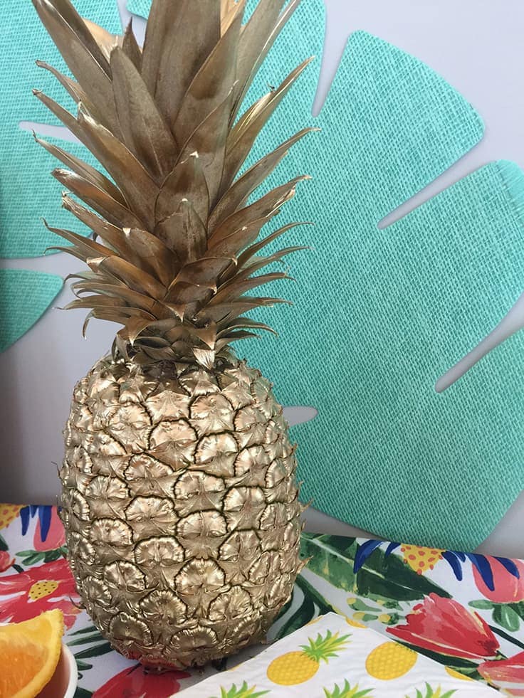 spray painted gold pineapple for easy tropical or luau party decor