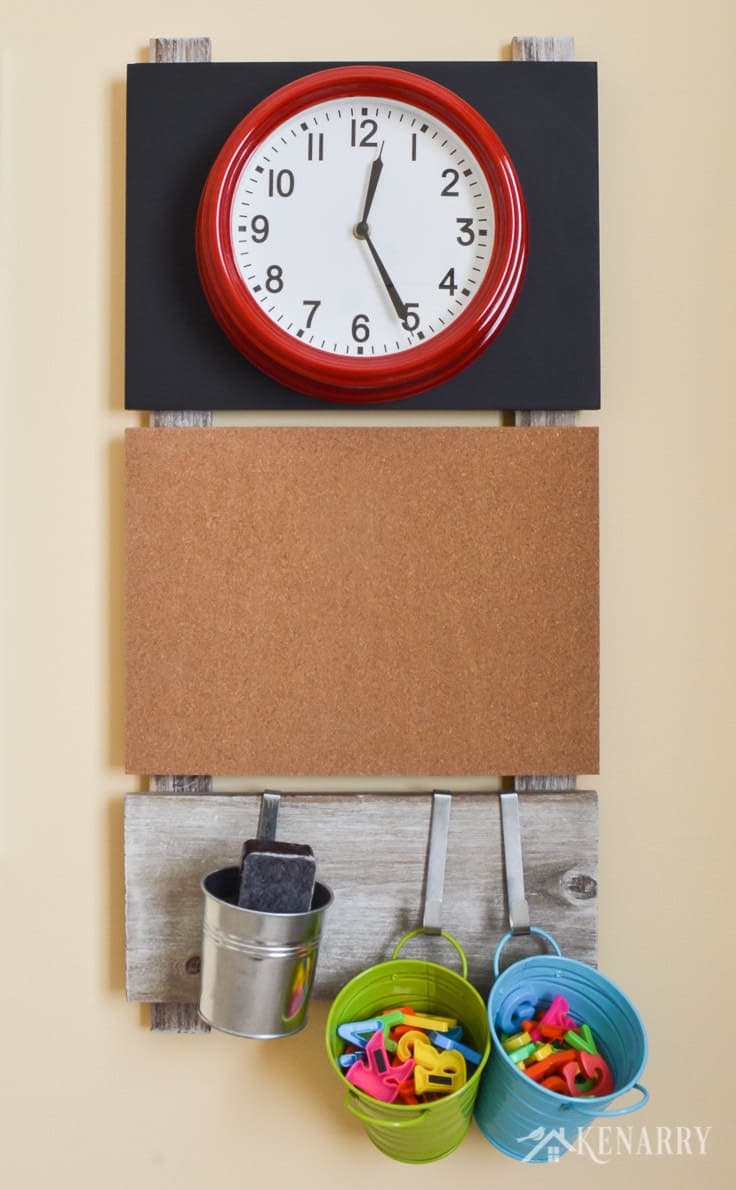 A large bright red clock is useful playroom wall decor to help children learn to tell time. This gallery wall or message board also includes a corkboard and storage containers for magnetic letters and a dry eraser.