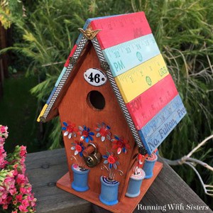 Make a fleastyle yardstick birdhouse. We'll show you how to distress the yardsticks and how to add flowers punched from cans. Great upcycle project!