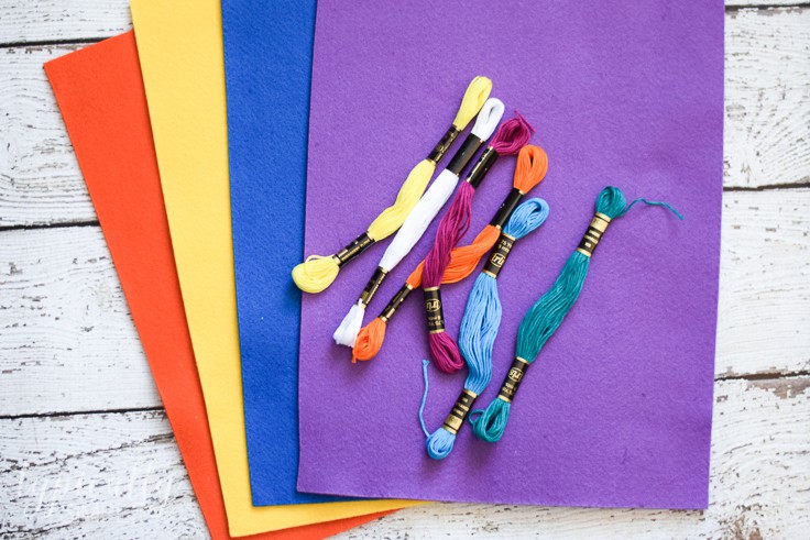 Colorful sheets of felt and assorted colors of thread. These can all be used to make corner bookmarks. 