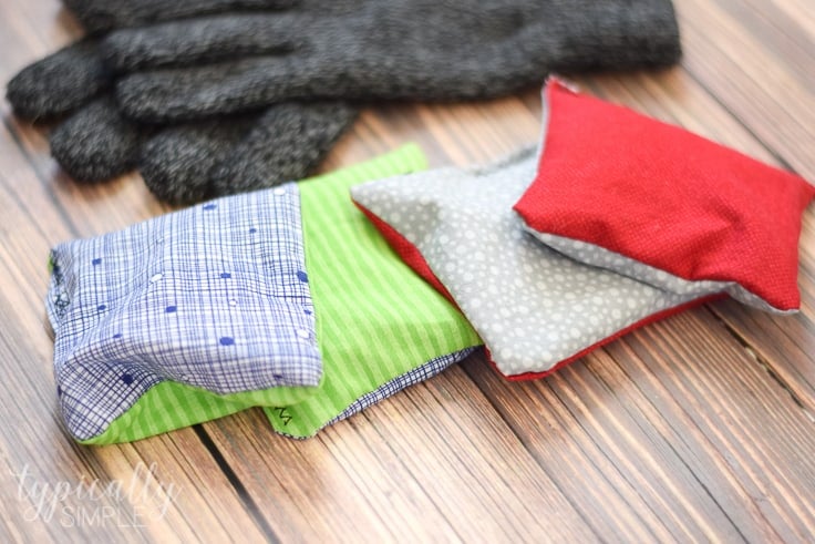 These DIY rice hand warmers are a great way to use up some fabric scraps! Plus it's the perfect beginner's sewing project for kids or adults!