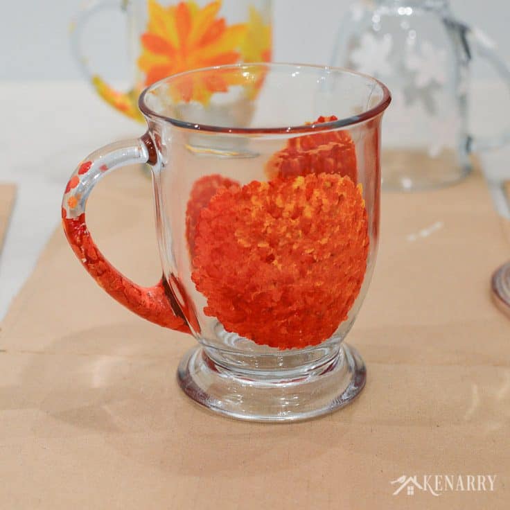 Layer dots of red, orange and yellow gloss enamel paints to create beautiful flowers on the side of DIY coffee mugs. Learn how in this easy craft tutorial.