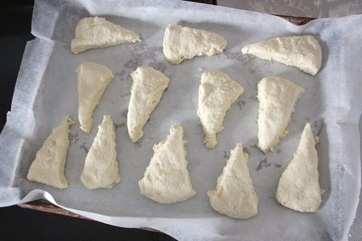 food processor buttermilk scones cut into wedges and sitting on a cookie sheet