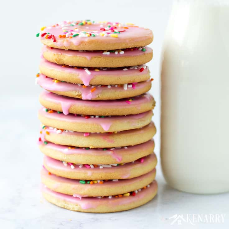 Create a fun dessert with the kids using this easy recipe for frosted cut out Donut Cookies made from sugar cookie dough. Decorated with sprinkles, these cookies are a great party treat! #baking #cookies #ideasforthehome #kenarry