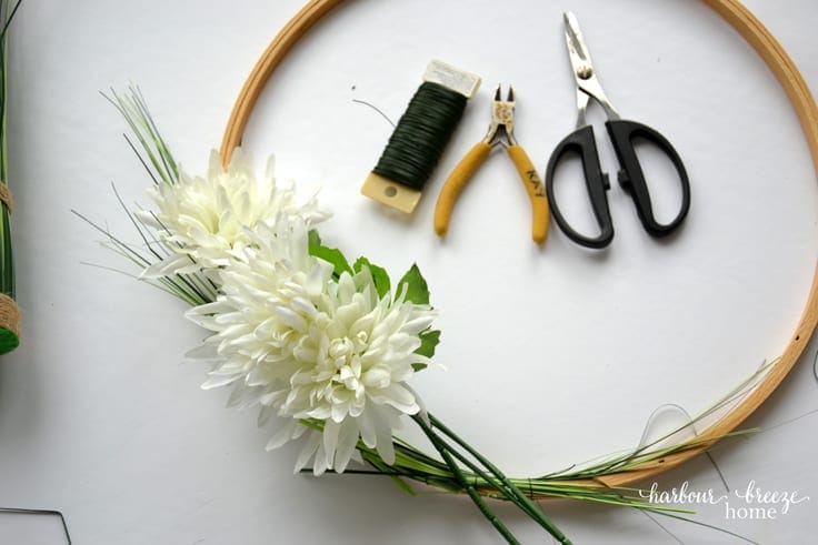 White flowers on an embroidery hoop wreath