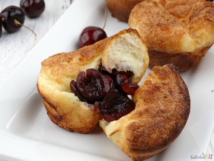 cherry popovers recipe on a white plate