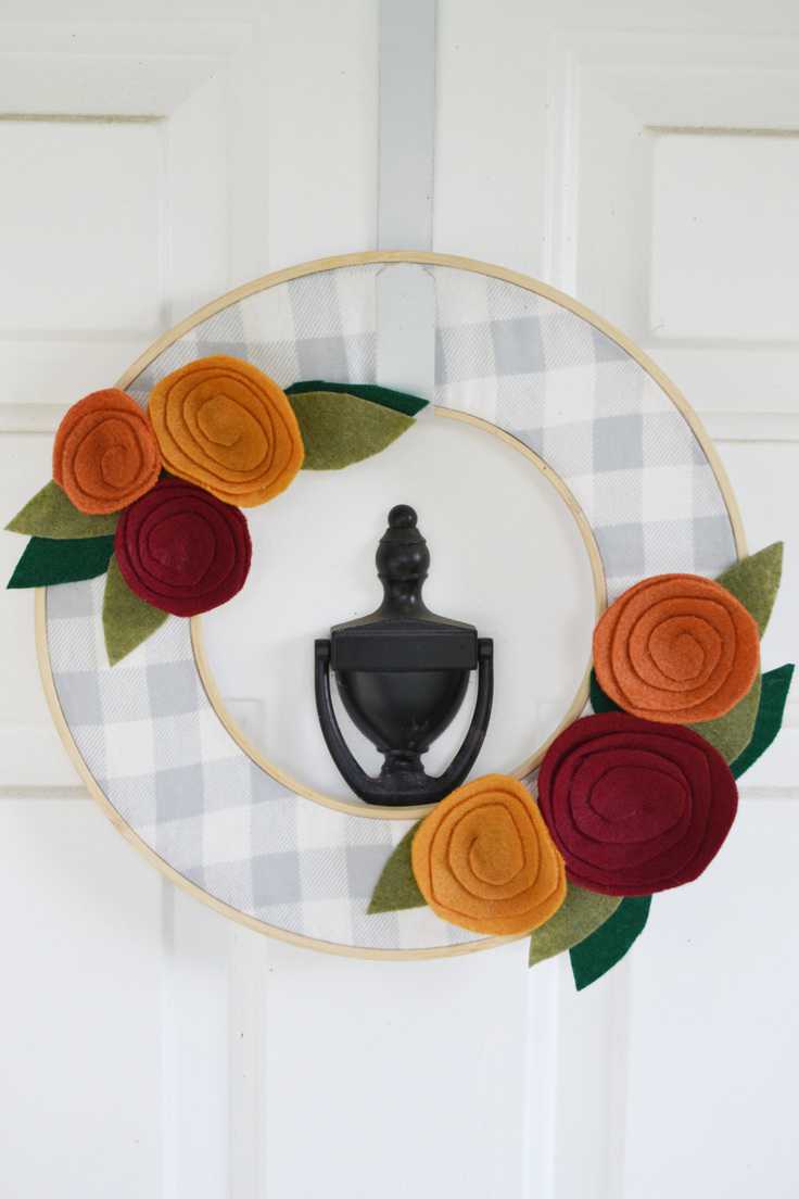 Want an easy DIY fall wreath idea for your front door? Make this simple fall wreath using some fabric, felt, embroidery hoops, and a little hot glue.  You can customize it to your own style...rustic, elegant, farmhouse, etc. #fallwreath #falldecor #wreaths #fall #fallfrontporch #falldecorideas #kenarry