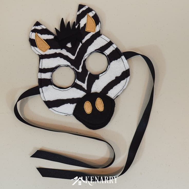 Create a kids zebra costume for a child who loves jungle animals and wild prints. This zebra mask and tutorial is great for a Halloween costume idea or for the dress-up bin.