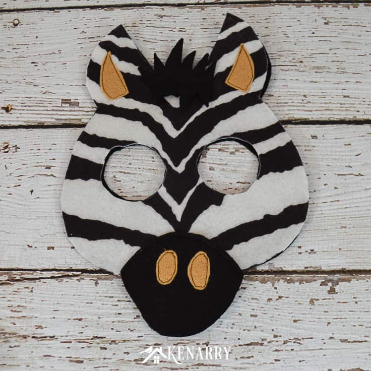 Use zebra striped felt and other felt fabric to create a diy zebra head mask for Halloween. This tutorial includes a free printable jungle mask template.